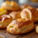 Delicious puff pastry dessert recipes featuring golden fruit turnovers and crispy palmiers.